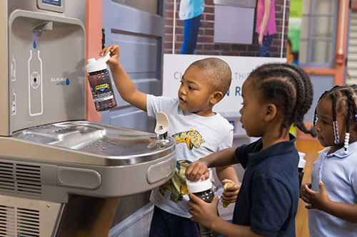 Student getting water from Elkay Bottle Filler
