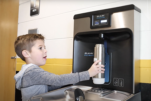 Student getting water from Elkay Bottle Filler