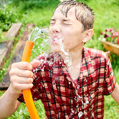 Drinking from the water hose.